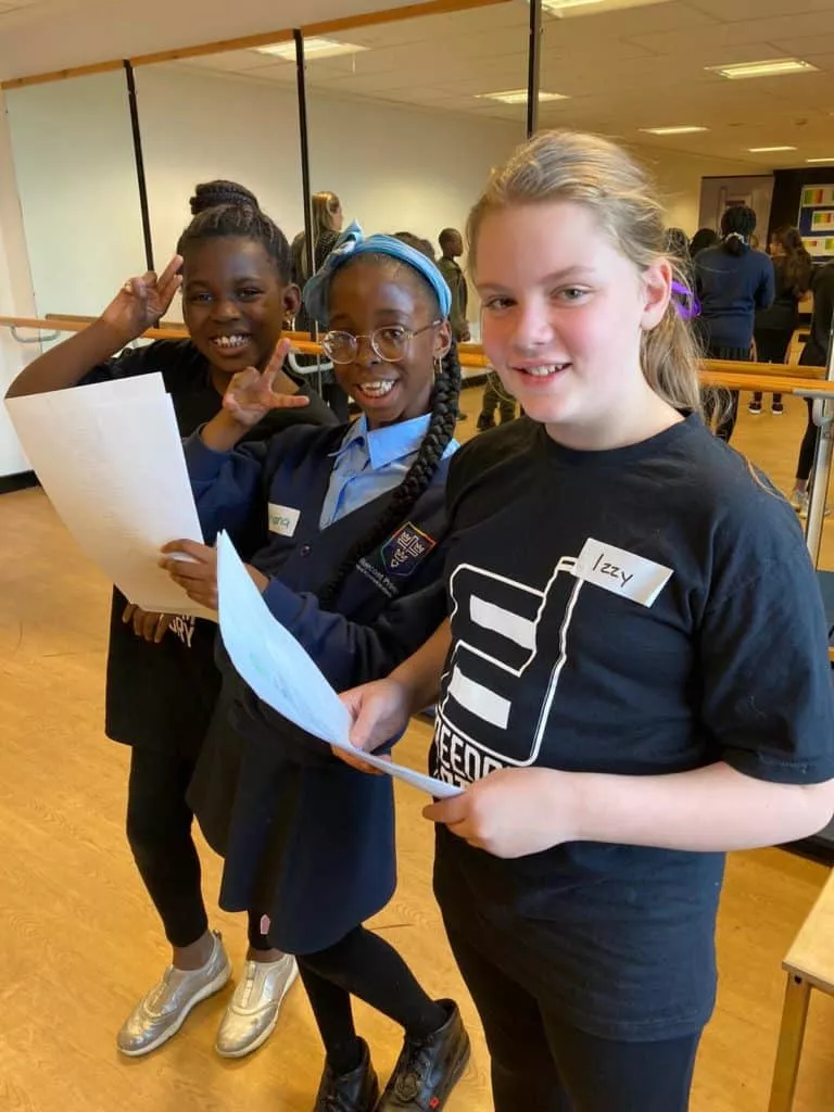 a group of children completing thier work